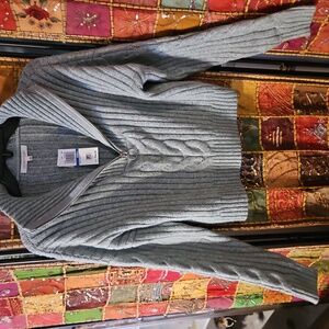 Ultra Flirt sweater features a two-tone, chunky knit and a half-zip collar fo